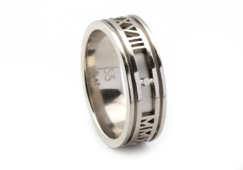 Impressive hand fabricated ring with roman numeral detail