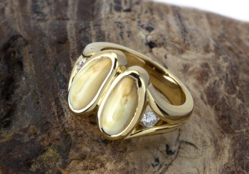 An elegant hand carved ring with elk Ivory and Diamonds.