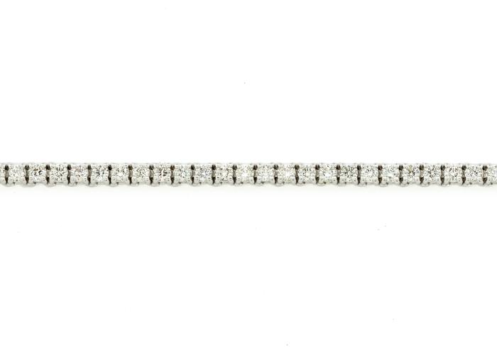 3 carat Diamond tennis bracelet in 14K white gold featuring round brilliant Diamonds in a four-prong setting.