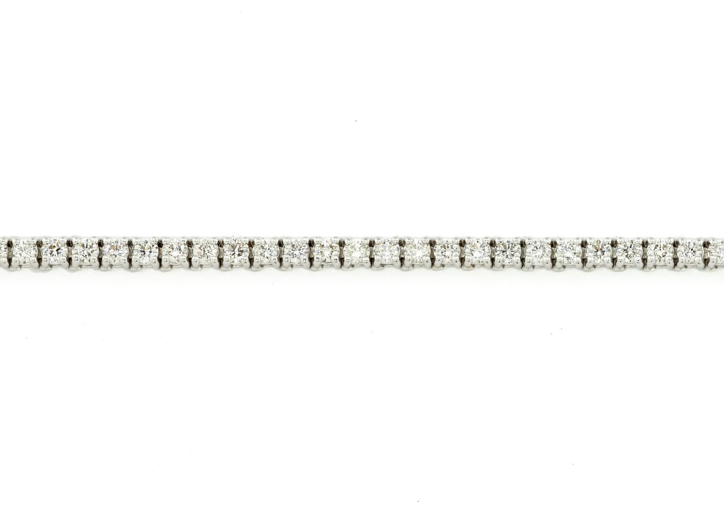 3 carat Diamond tennis bracelet in 14K white gold featuring round brilliant Diamonds in a four-prong setting.