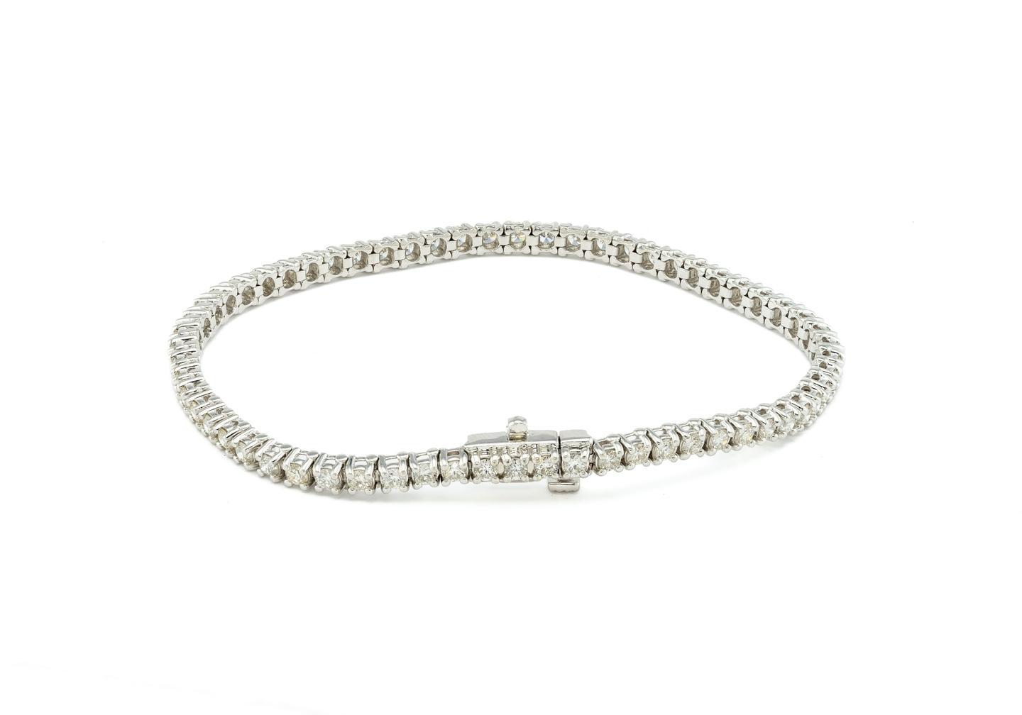 3 carat Diamond tennis bracelet in 14K white gold featuring round brilliant Diamonds in a four-prong setting.