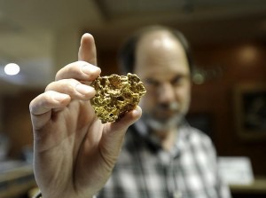 Don holding a nugget of gold